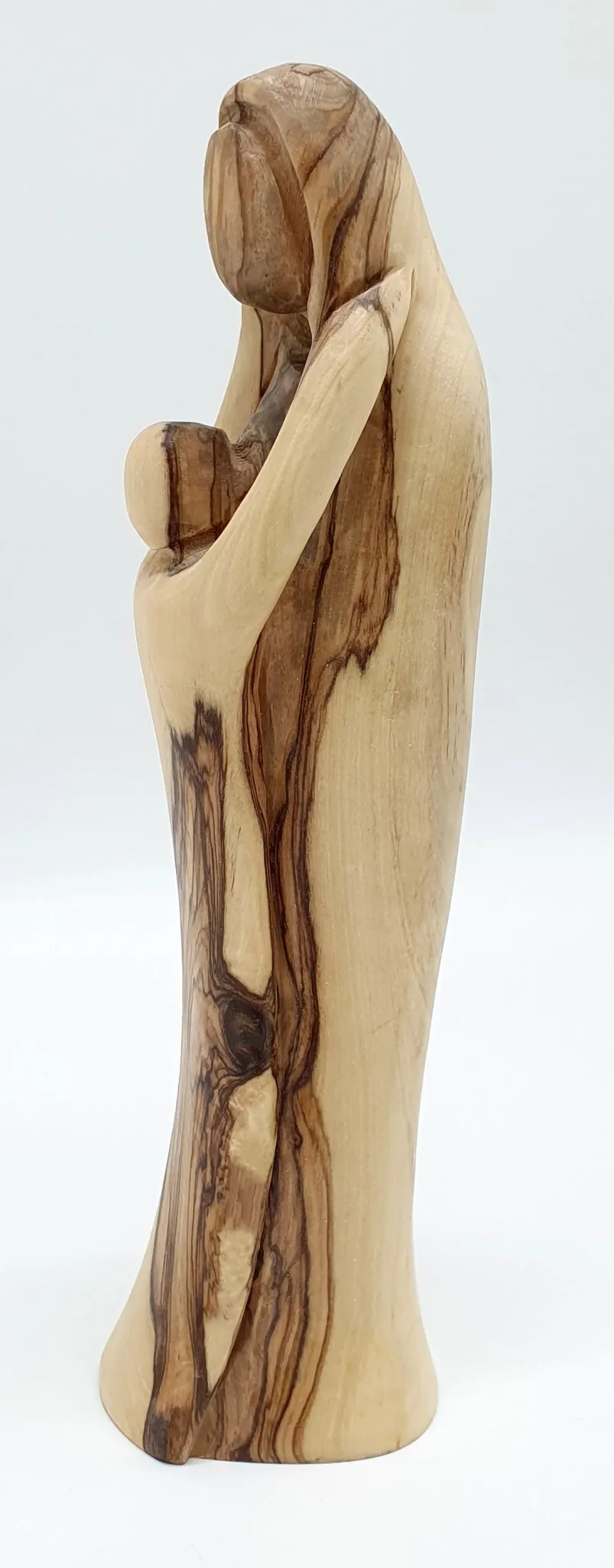 Experience the sublime beauty and intricate detailing of our Mary and Baby Jesus Handcrafted Olivewood Statue by Zuluf